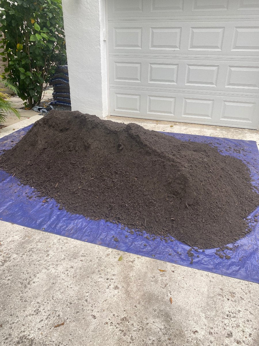 One yard of compost on a tarp